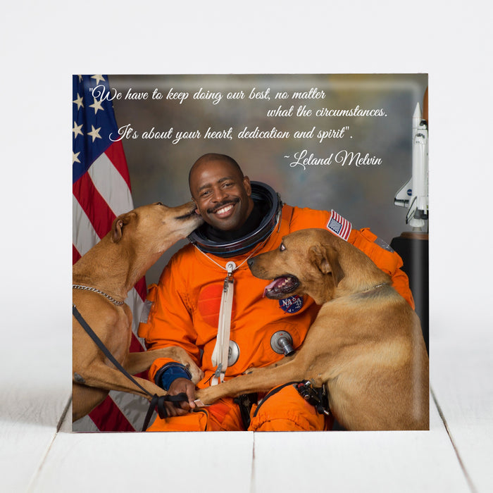Astronaut Leland Melvin with his rescue dogs Jake and Scout