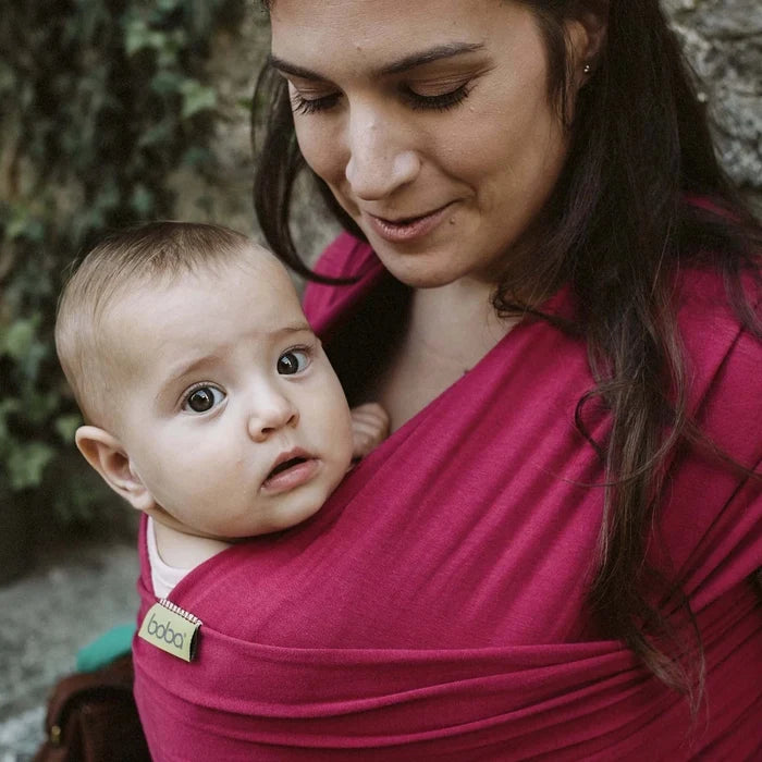 A Boba Classic Baby Wrap, made from a soft 95% French Terry cotton blend and 5% Spandex. Ergonomic, award-winning design fits babies from 7 Ibs to 35 Ibs, best up to 20 Ibs. Machine washable, dryer friendly, and certified hip-healthy. Sangria