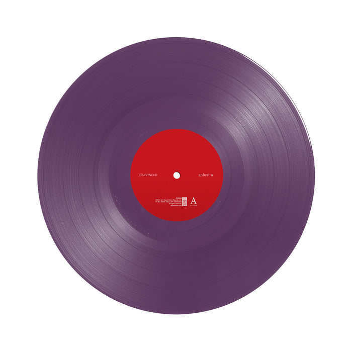 Opaque purple vinyl against a white background. There is a red label in the center.