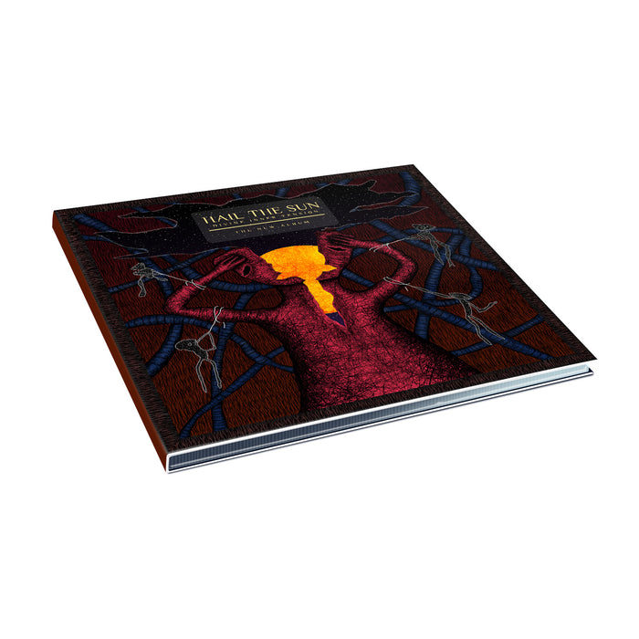 A hardcover book from Hail The Sun features a tree with dark branches, a glowing orange-red center, and the title Hail The Sun on top—mirroring their Divine Inner Tension album (digital download released August 2023) on a plain white background.