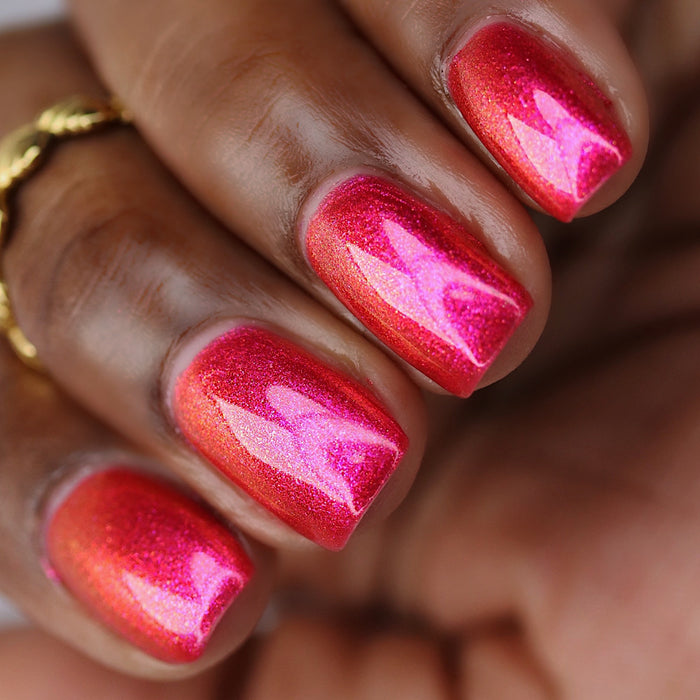 Close-up of nails painted with La Vie En Rose Nail Lacquer on deep skin tone.