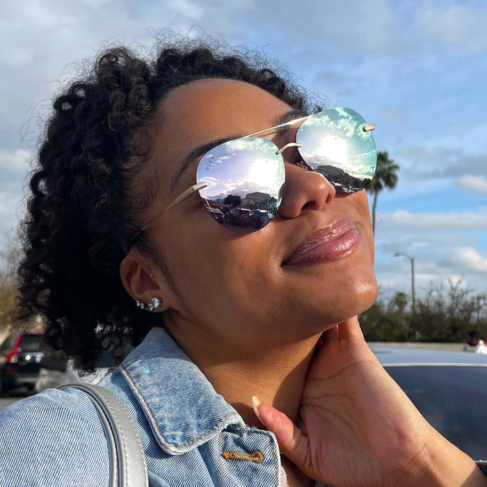UGC - customer content - female wearing lenox brushed gold cherry blossom mirror sunglasses