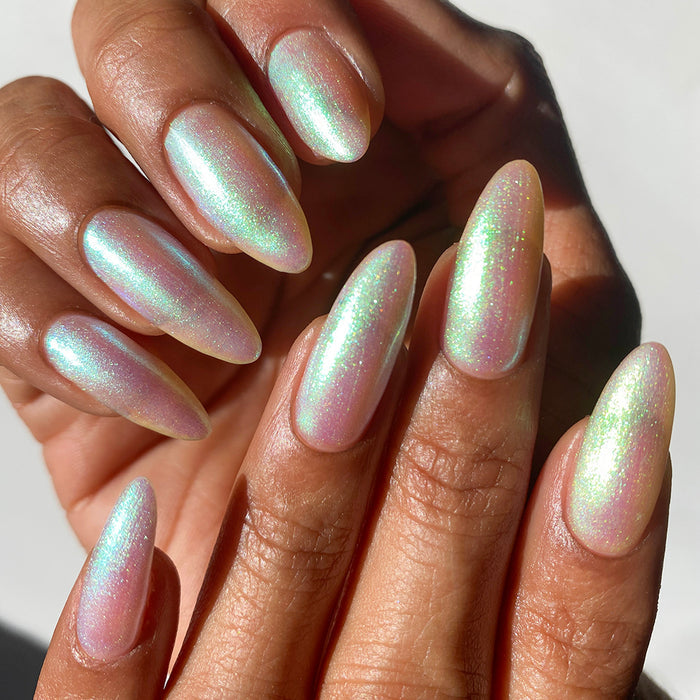 Nails painted with Lucidum Nail Lacquer on medium skin tone.