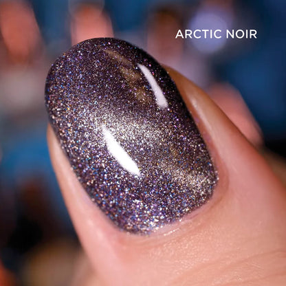 Close-up of one nail painted with Arctic Noir Nail Lacquer, on a dark blurred background.