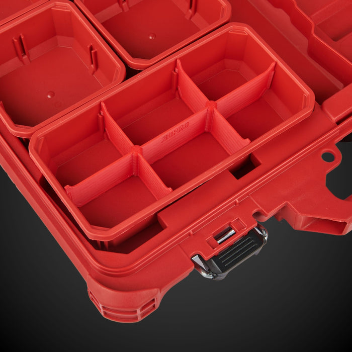 Red Miwaukee tool box with red 6-way low double bin divider on a black background