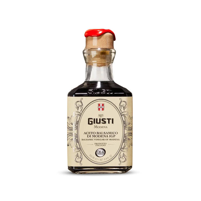 Bottle of Giusti Balsamic Vinegar on a white background