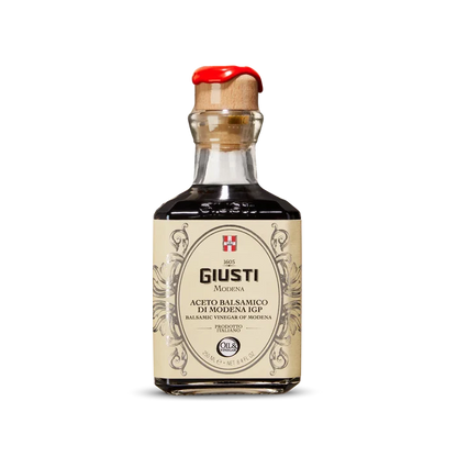 Bottle of Giusti Balsamic Vinegar on a white background