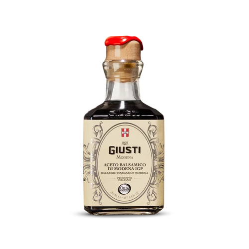 Bottle of Giusti Balsamic Vinegar on a white background