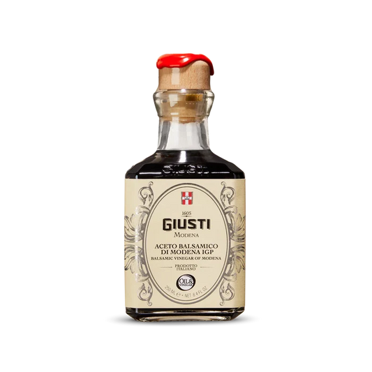 Bottle of Giusti Balsamic Vinegar on a white background