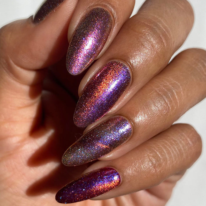 Close-up of nails painted with Amorem Nail Lacquer on medium skin tone.