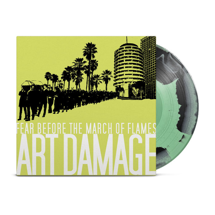 A Black & Mint Green Mixed vinyl record by Fear Before, partly pulled from its cover for the album Art Damage. The sleeve has a green-yellow background with silhouettes and bold white text. Limited to 250 copies.