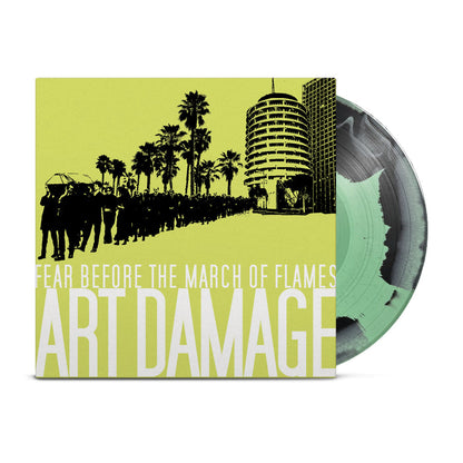 A Black & Mint Green Mixed vinyl record by Fear Before, partly pulled from its cover for the album Art Damage. The sleeve has a green-yellow background with silhouettes and bold white text. Limited to 250 copies.