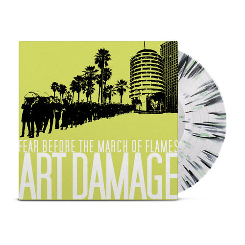A Limited Edition LP Vinyl from Fear Before, with black and white splatter, is partially pulled from its cover featuring palm tree silhouettes, a marching crowd, and buildings on a yellow background with bold ART DAMAGE text.