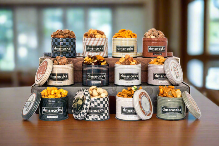 Vintage-themed Bar Cart Snacks tins filled with assorted savory and sweet snacks, perfect for pairing with beverages.