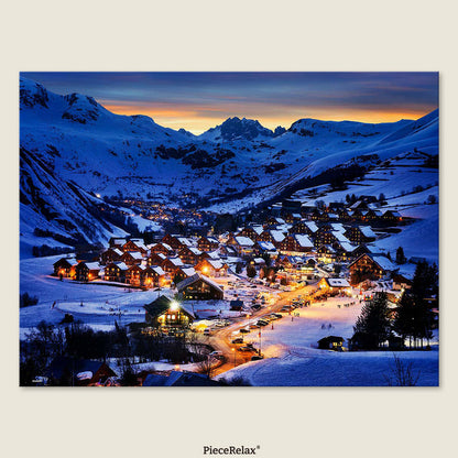 In the heart of the Alps, winter lights twinkle as miniature towns rest beneath majestic peaks.