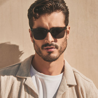 on model - male wearing diff eyewear featuring the billie square sunglasses with a black smoke crystal frame and grey polarized lenses front view