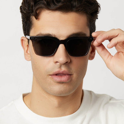 on model - male wearing diff eyewear featuring the billie square sunglasses with a black smoke crystal frame and grey polarized lenses