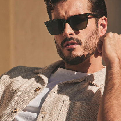 on model - male wearing diff eyewear featuring the billie square sunglasses with a dark olive green crystal frame and g15 polarized lenses front view