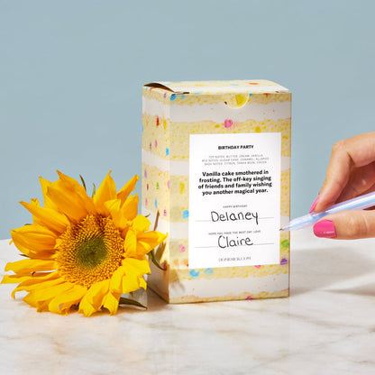 The back packaging of the candle where one can write in who the gift is for and from.