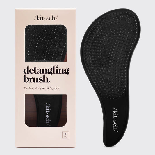Black Kitsch Detangling Brush on a neutral background