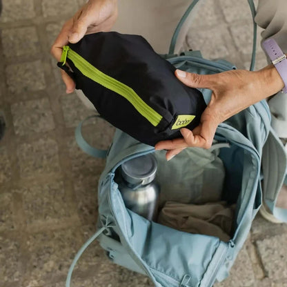 A lightweight, Boba Air Baby Travel Carrier with padded mesh straps, leg openings, adjustable shoulder straps, and an integrated hood. Compact and self-storing, it fits babies 4-24 months (15+ lbs) and children up to 45 lbs, Black