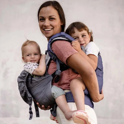 A lightweight, Boba Air Baby Travel Carrier with padded mesh straps, leg openings, adjustable shoulder straps, and an integrated hood. Compact and self-storing, it fits babies 4-24 months (15+ lbs) and children up to 45 lbs, Gray