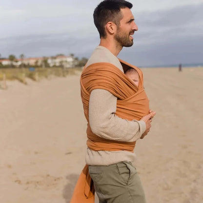 A Boba Classic Baby Wrap, made from a soft 95% French Terry cotton blend and 5% Spandex. Ergonomic, award-winning design fits babies from 7 Ibs to 35 Ibs, best up to 20 Ibs. Machine washable, dryer friendly, and certified hip-healthy. Organic Fox