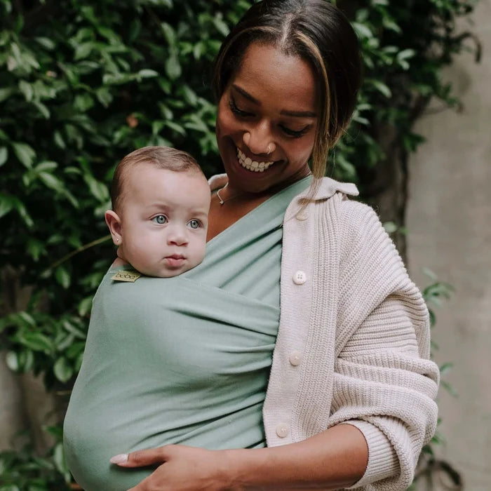 A Boba Classic Baby Wrap, made from a soft 95% French Terry cotton blend and 5% Spandex. Ergonomic, award-winning design fits babies from 7 Ibs to 35 Ibs, best up to 20 Ibs. Machine washable, dryer friendly, and certified hip-healthy. Sage Green