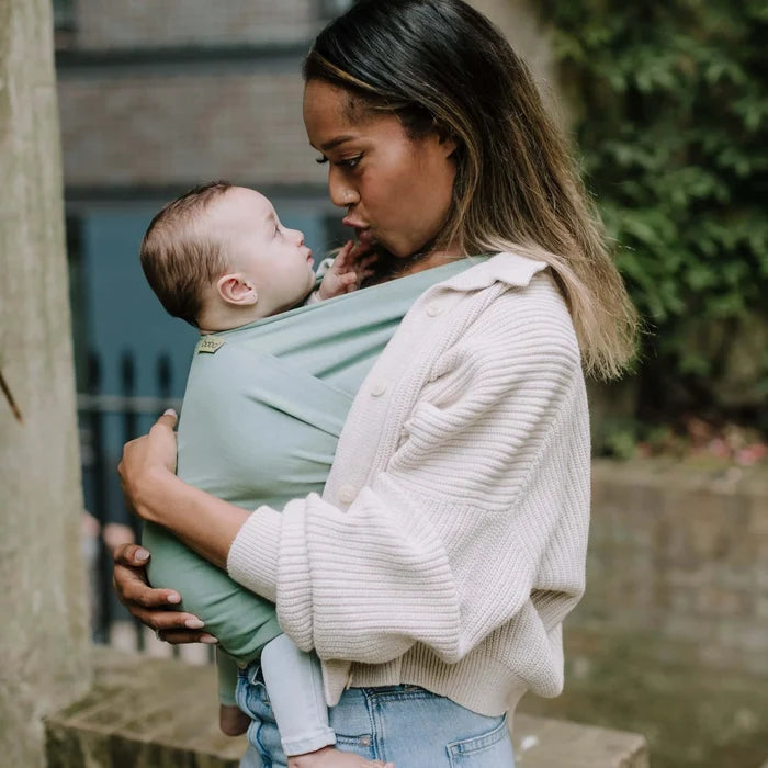 A Boba Classic Baby Wrap, made from a soft 95% French Terry cotton blend and 5% Spandex. Ergonomic, award-winning design fits babies from 7 Ibs to 35 Ibs, best up to 20 Ibs. Machine washable, dryer friendly, and certified hip-healthy. Sage Green