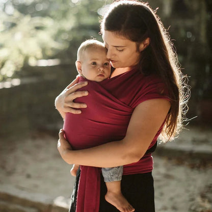 A Boba Classic Baby Wrap, made from a soft 95% French Terry cotton blend and 5% Spandex. Ergonomic, award-winning design fits babies from 7 Ibs to 35 Ibs, best up to 20 Ibs. Machine washable, dryer friendly, and certified hip-healthy. Sangria