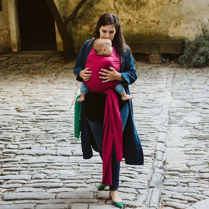 A Boba Classic Baby Wrap, made from a soft 95% French Terry cotton blend and 5% Spandex. Ergonomic, award-winning design fits babies from 7 Ibs to 35 Ibs, best up to 20 Ibs. Machine washable, dryer friendly, and certified hip-healthy. Sangria