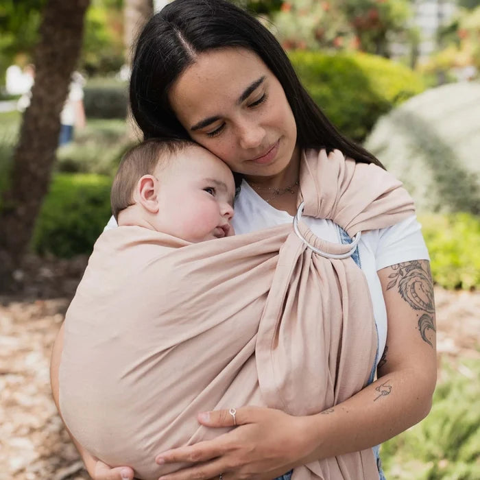 A Boba Ring Sling Baby Carrier made from a unique linen bamboo viscose fabric blend, perfect for all seasons. Lightweight and breathable, it stores compactly, ideal for newborn snuggles to toddler ups and downs (8 - 35Ibs). Peony Pink