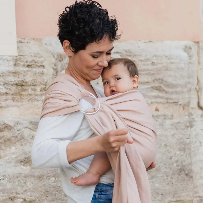 A Boba Ring Sling Baby Carrier made from a unique linen bamboo viscose fabric blend, perfect for all seasons. Lightweight and breathable, it stores compactly, ideal for newborn snuggles to toddler ups and downs (8 - 35Ibs). Peony Pink