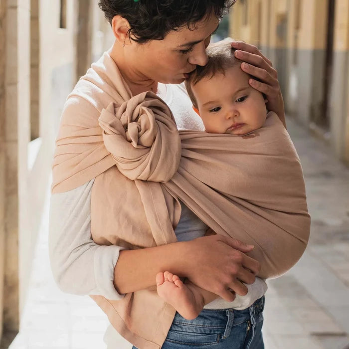 A Boba Ring Sling Baby Carrier made from a unique linen bamboo viscose fabric blend, perfect for all seasons. Lightweight and breathable, it stores compactly, ideal for newborn snuggles to toddler ups and downs (8 - 35Ibs). Peony Pink