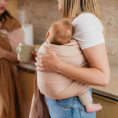 A Boba Ring Sling Baby Carrier made from a unique linen bamboo viscose fabric blend, perfect for all seasons. Lightweight and breathable, it stores compactly, ideal for newborn snuggles to toddler ups and downs (8 - 35Ibs). Peony Pink