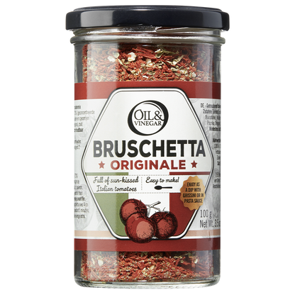 A jar of Bruschetta Originale dried herb blend by Oil & Vinegar, displaying the product label with the name and an image of dried tomatoes and herbs inside.