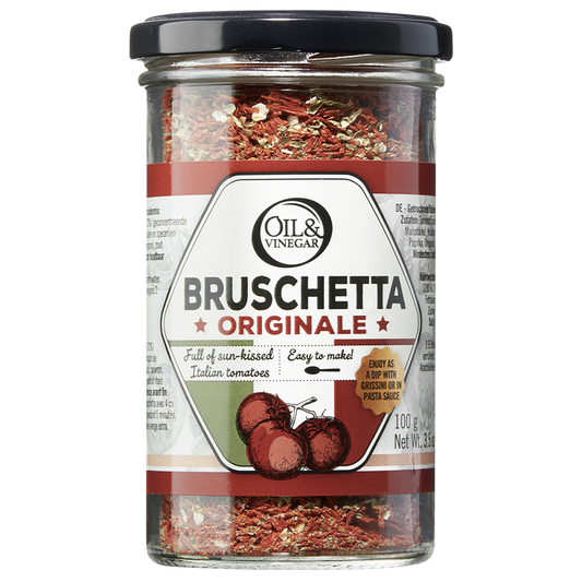 A jar of Bruschetta Originale dried herb blend by Oil & Vinegar, displaying the product label with the name and an image of dried tomatoes and herbs inside.