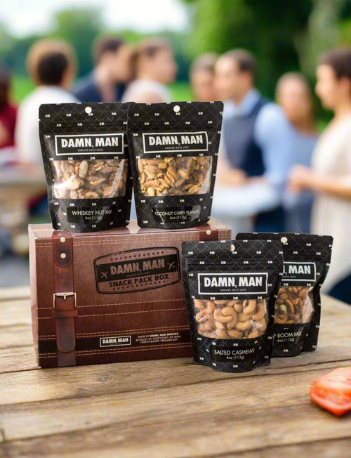 Build Your Own 4-Pack Box Mixed Nuts with Damn, Man Snacks on display at an outdoor gathering. Protein-packed gourmet nut snack box. Perfect for Fathers Day Gift or gifts for him