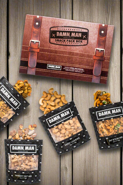 Build Your Own 4-Pack Box Mixed Nuts - Damn, Man Snacks featuring whisky nut mix, salted cashews, tap room mix, and roasted peanuts.