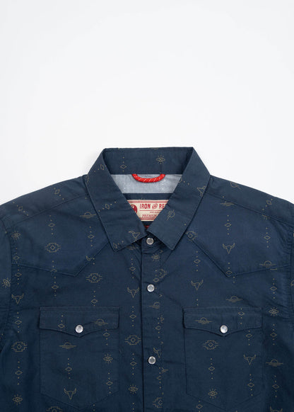 Navy blue western shirt with subtle geometric patterns and silver snap buttons, featuring two chest pockets and a pointed collar.