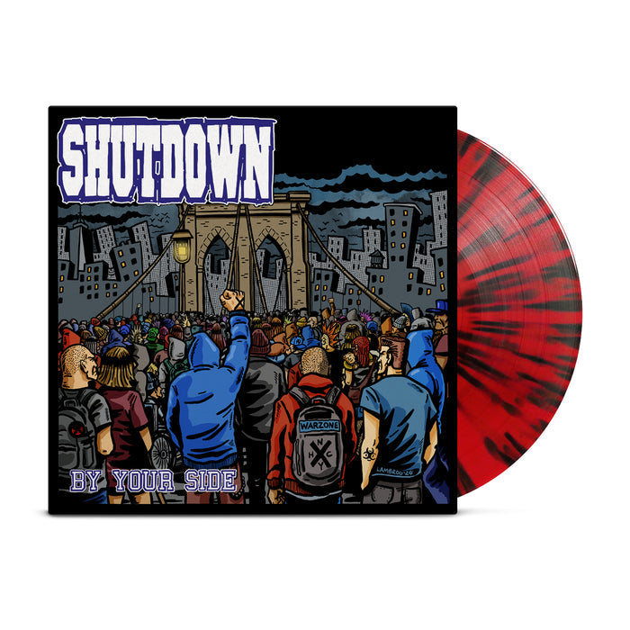 A black and red vinyl peeks out of a black jacket with an image of a mob of people at the entrance of a castle moat with the words "Shutdown: Always Here By Your Side" on it.