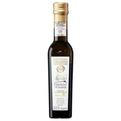 A bottle of Castillo di Canena extra virgin olive oil with a label showing the brand name and the olive variety 'Picual'.