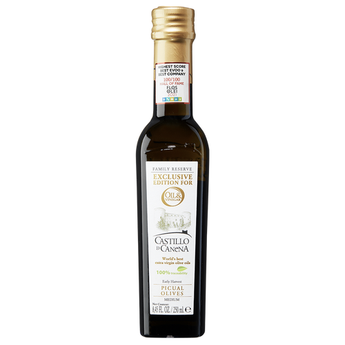 A bottle of Castillo di Canena extra virgin olive oil with a label showing the brand name and the olive variety 'Picual'.