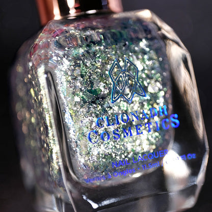 Angled, close-up of Catacomb Nail Lacquer bottle on a black background.