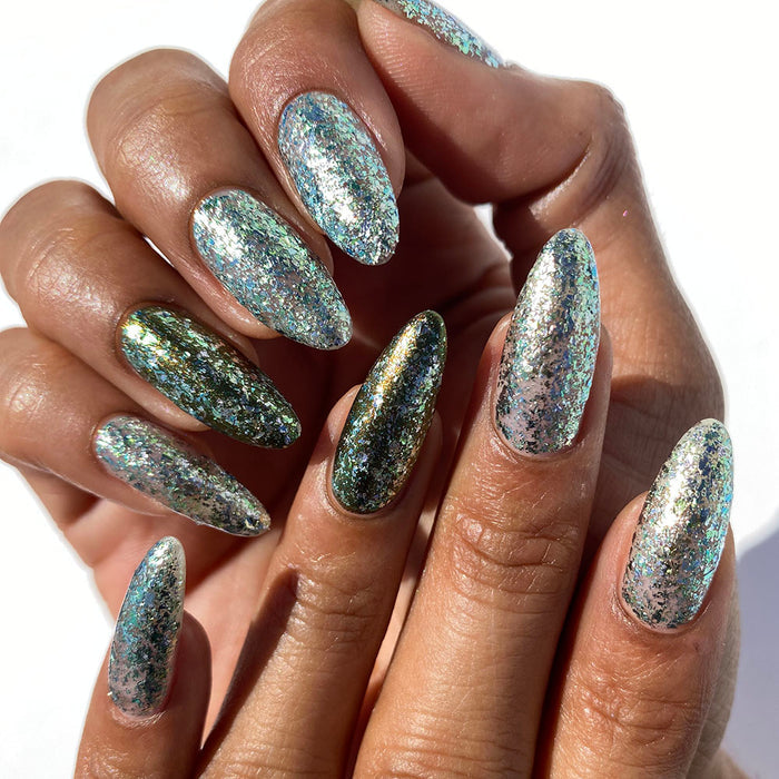 Close-up of nails painted with Catacomb Nail Lacquer on medium skin tone.