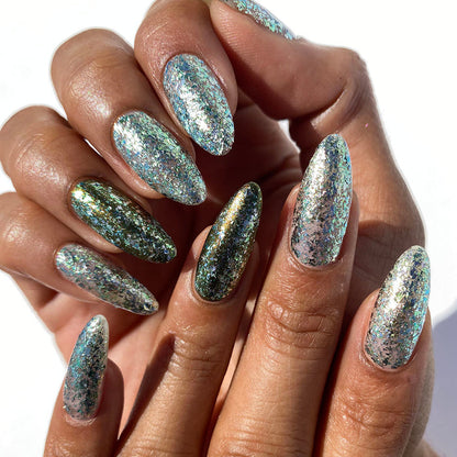 Close-up of nails painted with Catacomb Nail Lacquer on medium skin tone.