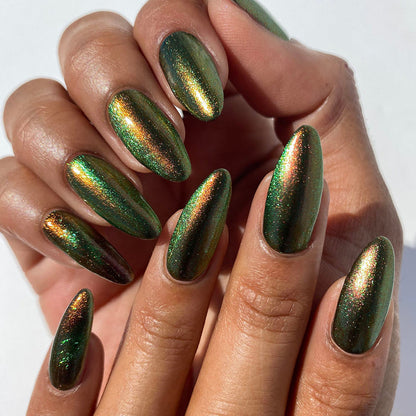 Top angled close-up shot of nails done with Cemetery Nail Lacquer on medium skin tone.