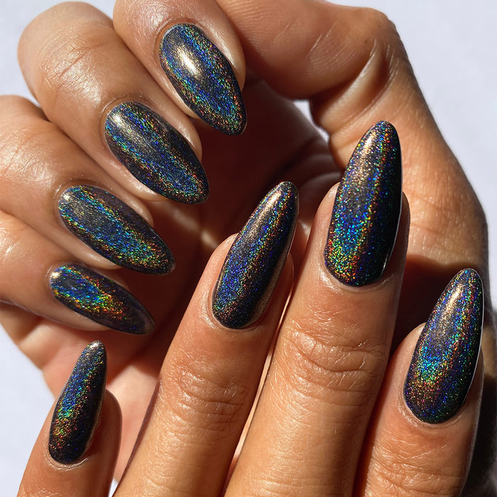 Close-up of nails painted with Chocholo Chips Nail Lacquer on medium skin tone.