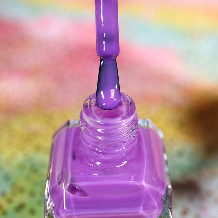 Close-up of opened nail polish bottle containing Cirrus Nail Lacquer, with brush showing.