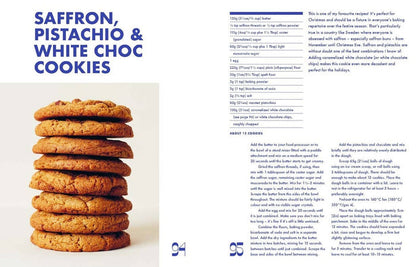 Stack of cookies with a recipe card for Saffron, Pistachio & White Choc Cookies on a white background
